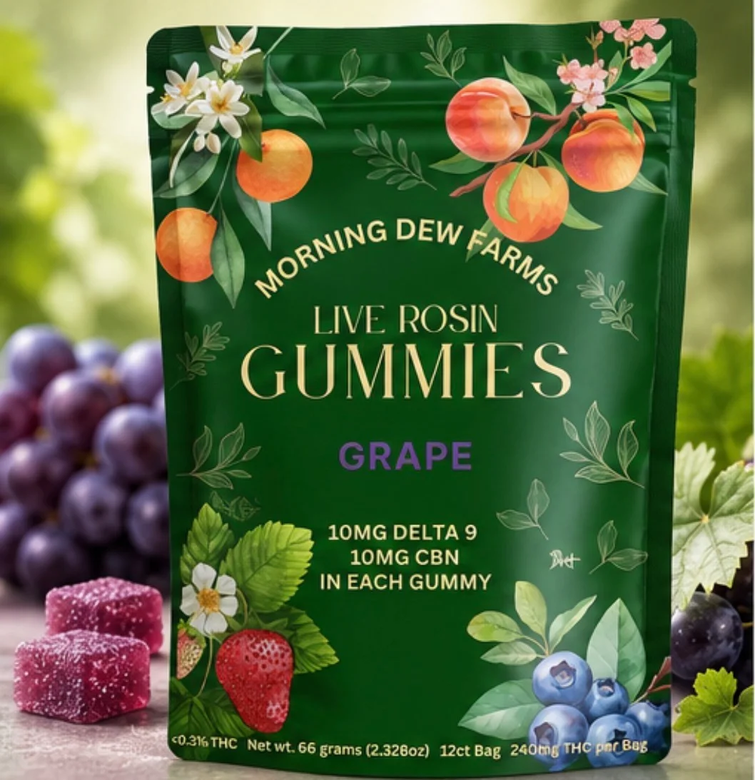 The green Live Rosin Gummies Grape pouch surrounded by strawberries and blueberries, with sugared grape gummies in front.